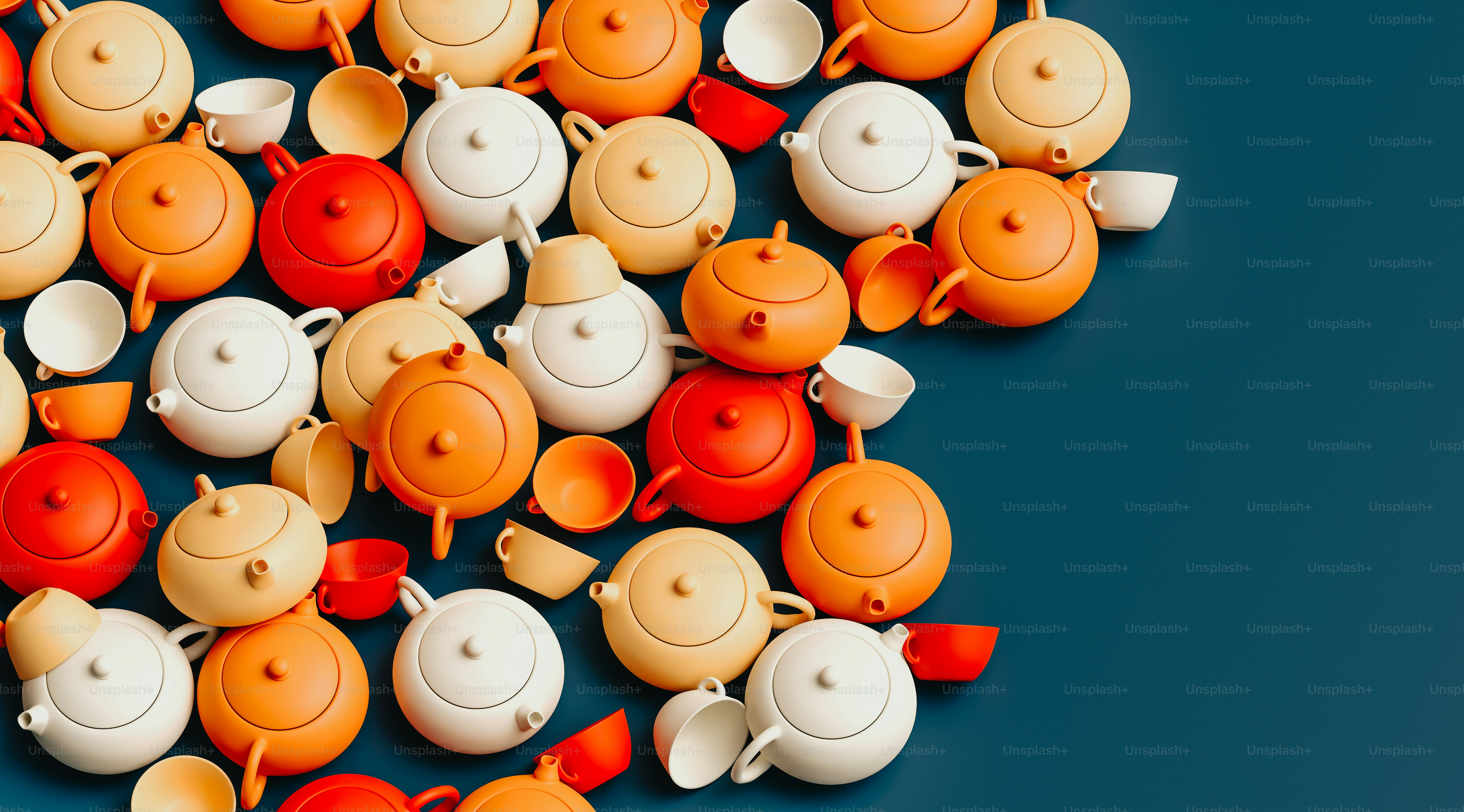 a group of orange and white teapots sitting next to each other