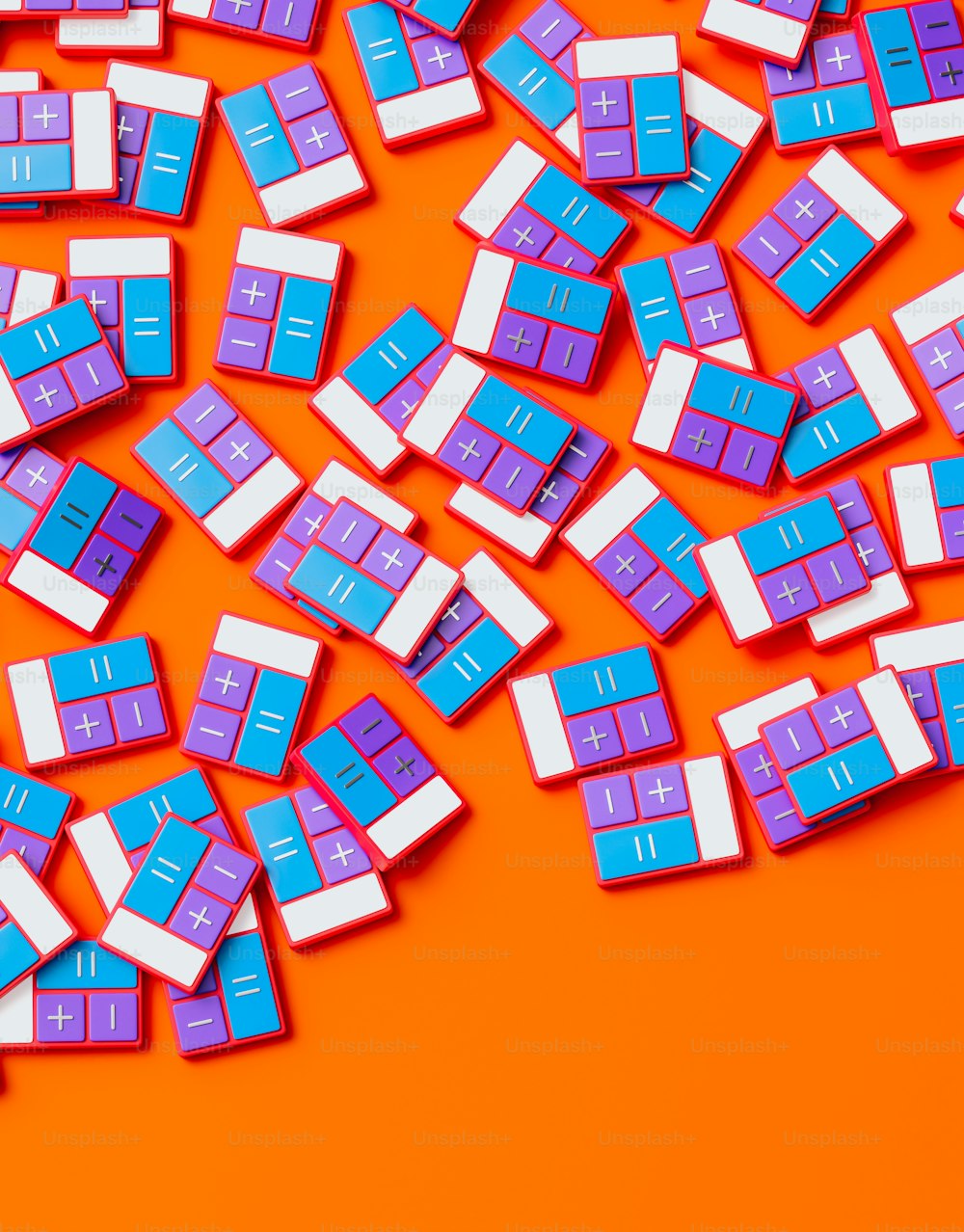 a pile of blue and white keys on an orange background