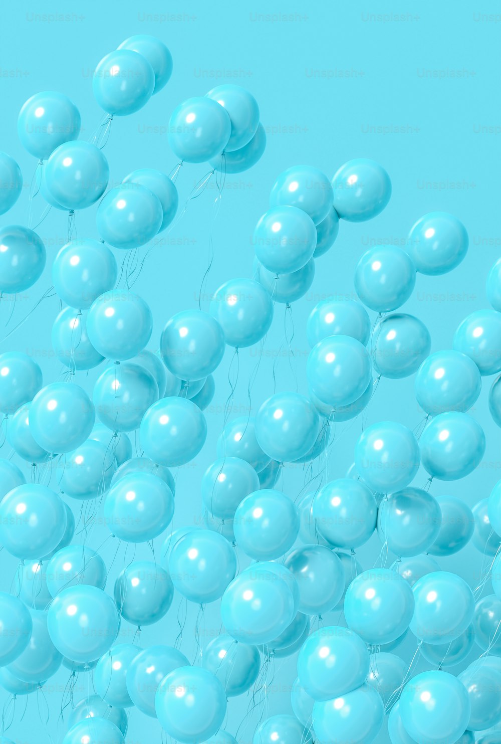 a bunch of blue balloons floating in the air