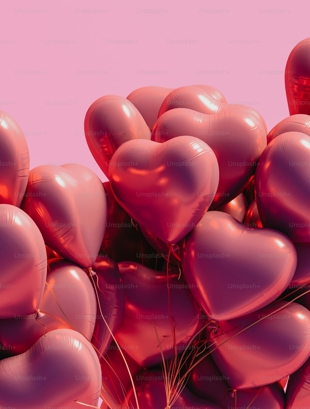 a bunch of heart shaped balloons in the air