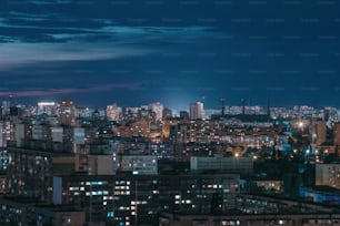 a view of a city at night from the top of a building