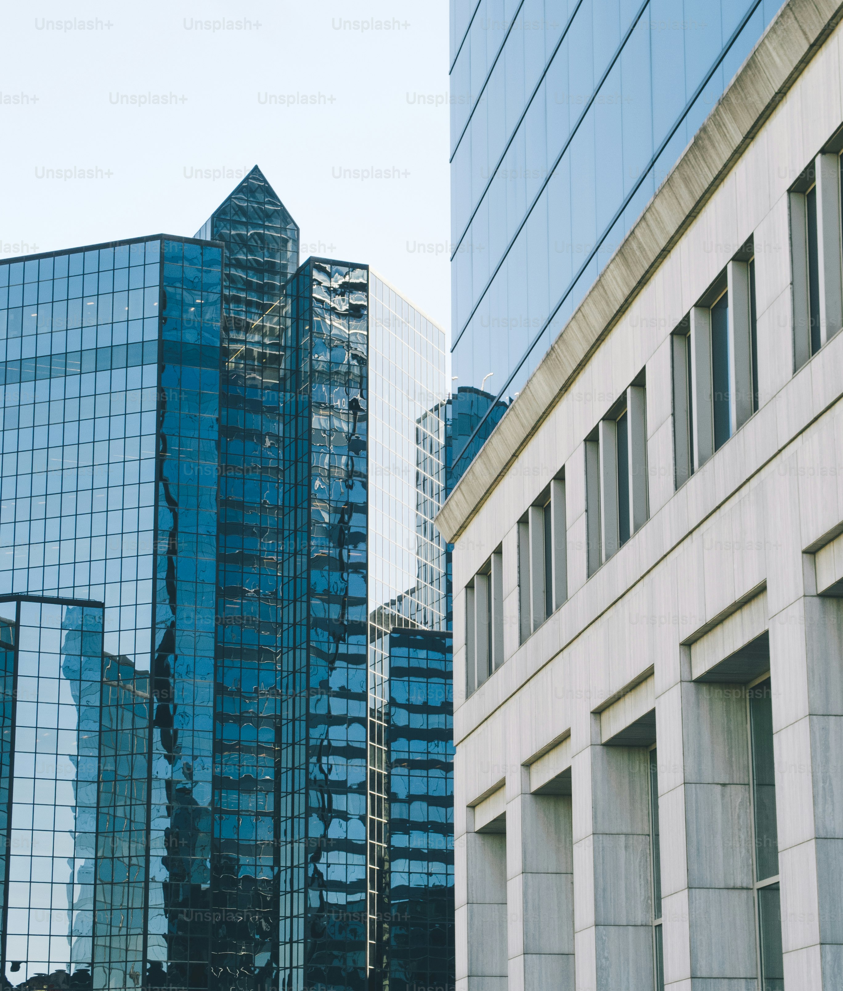a couple of tall buildings sitting next to each other