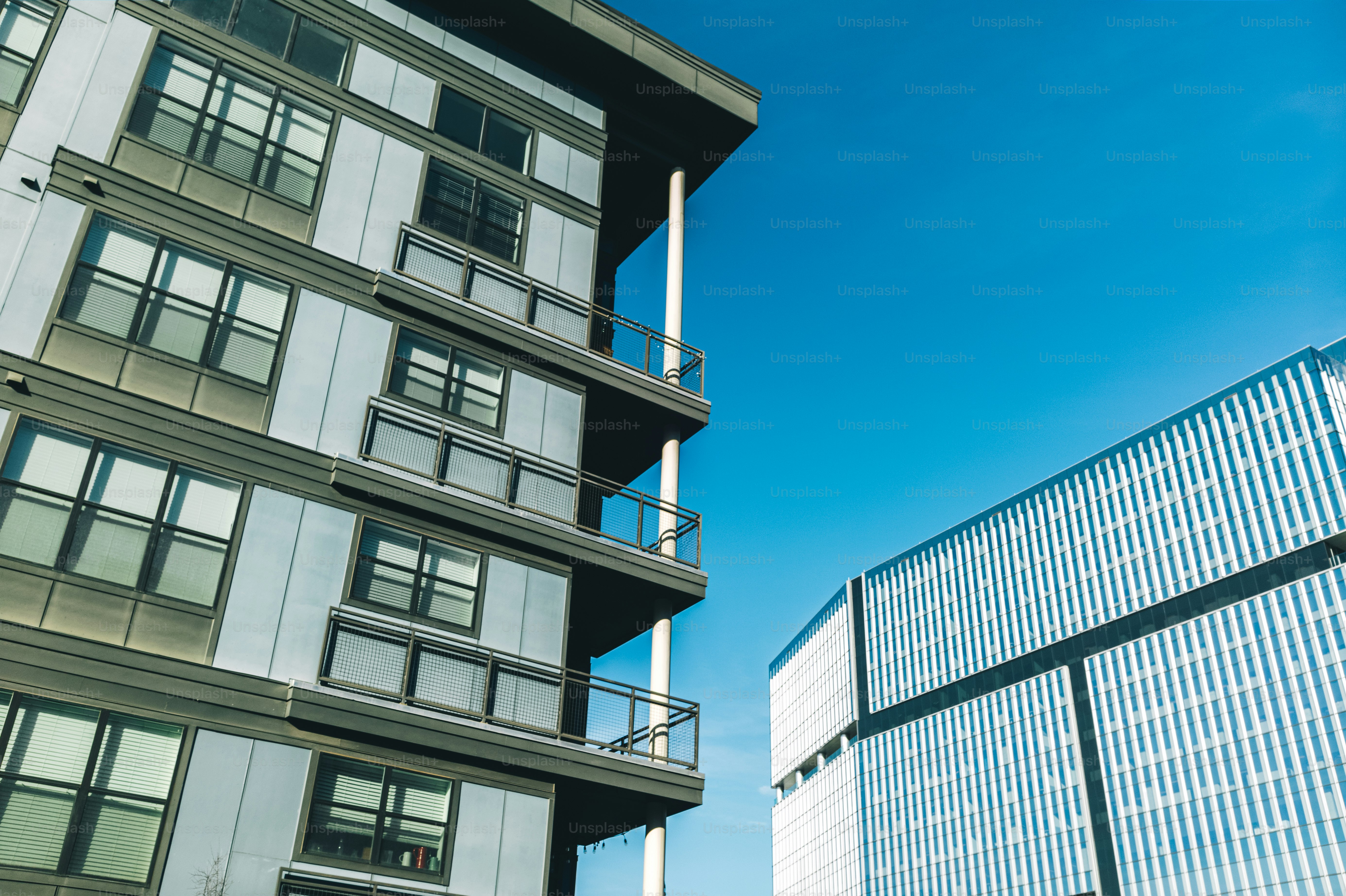 a tall building next to a very tall building