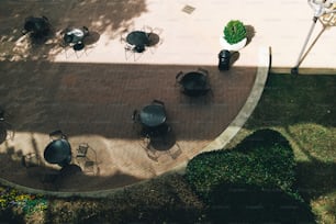 an overhead view of a patio with tables and chairs