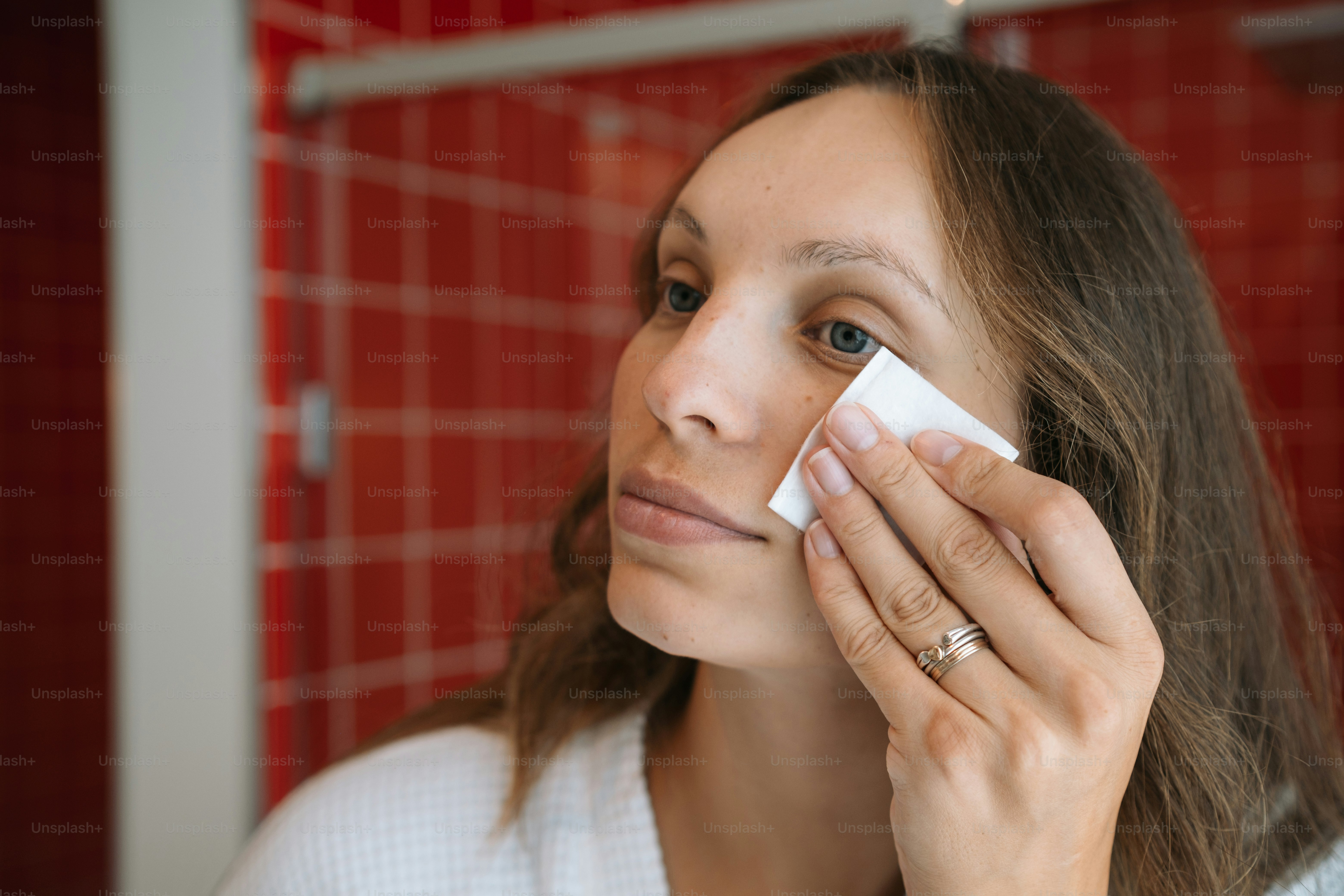a woman holding a piece of paper in her hand
