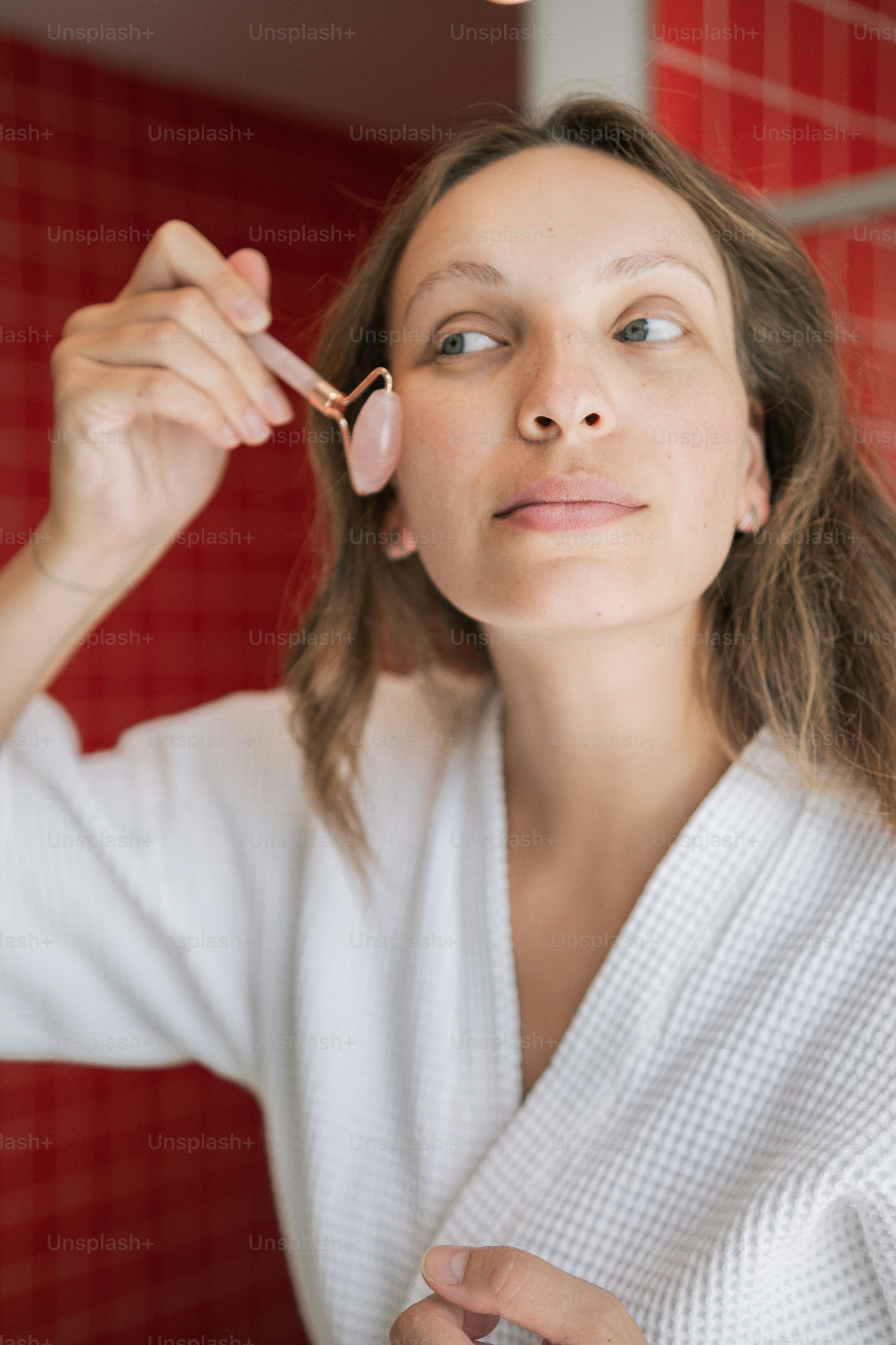 a woman brushing her teeth in a bathroom