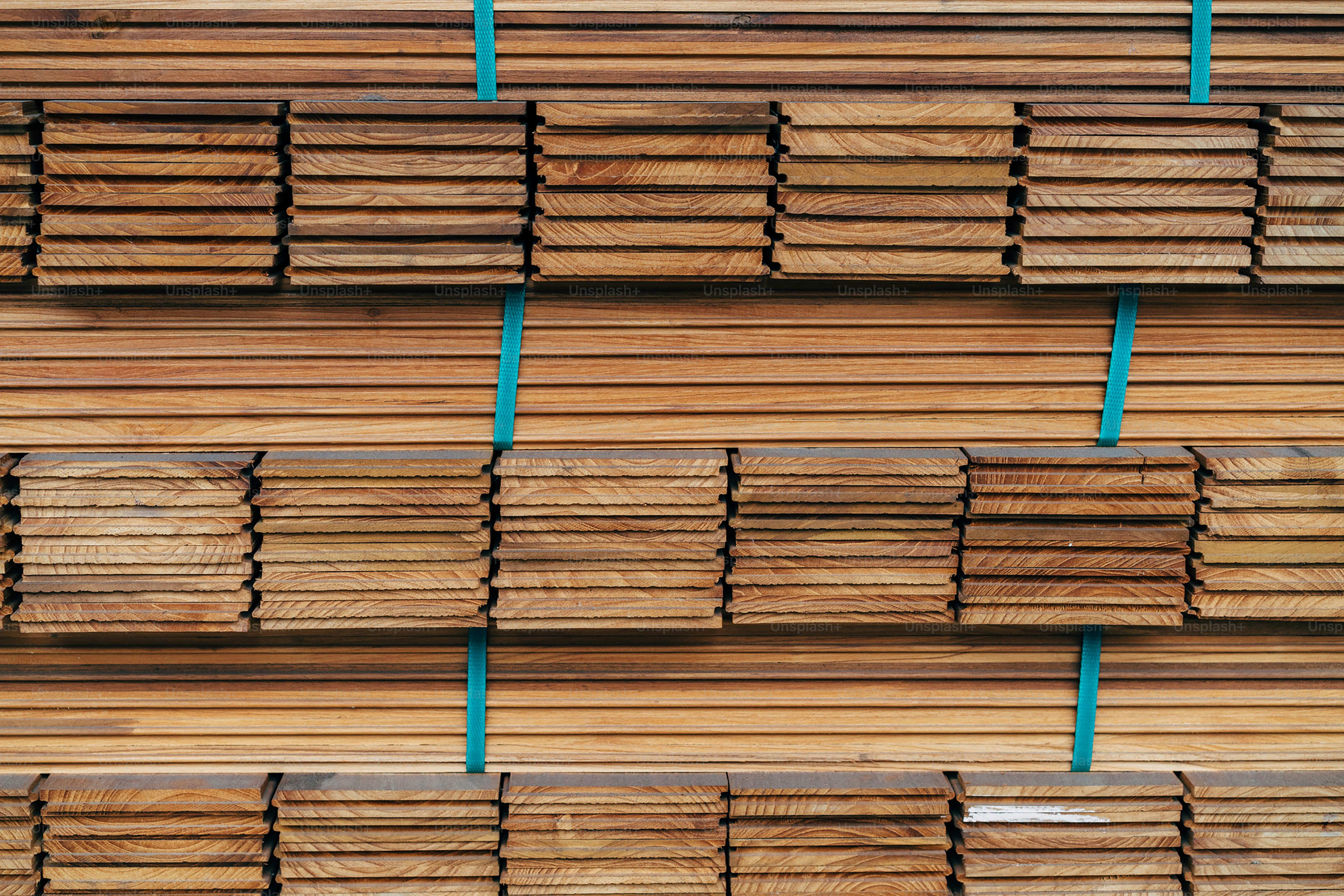 A stack of wooden boards stacked on top of each other photo Planks