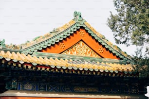 the roof of a building with a tree in the background