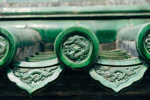 a close up of a green metal object