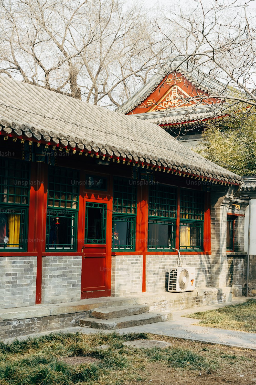 a red and white building with a clock on the front of it