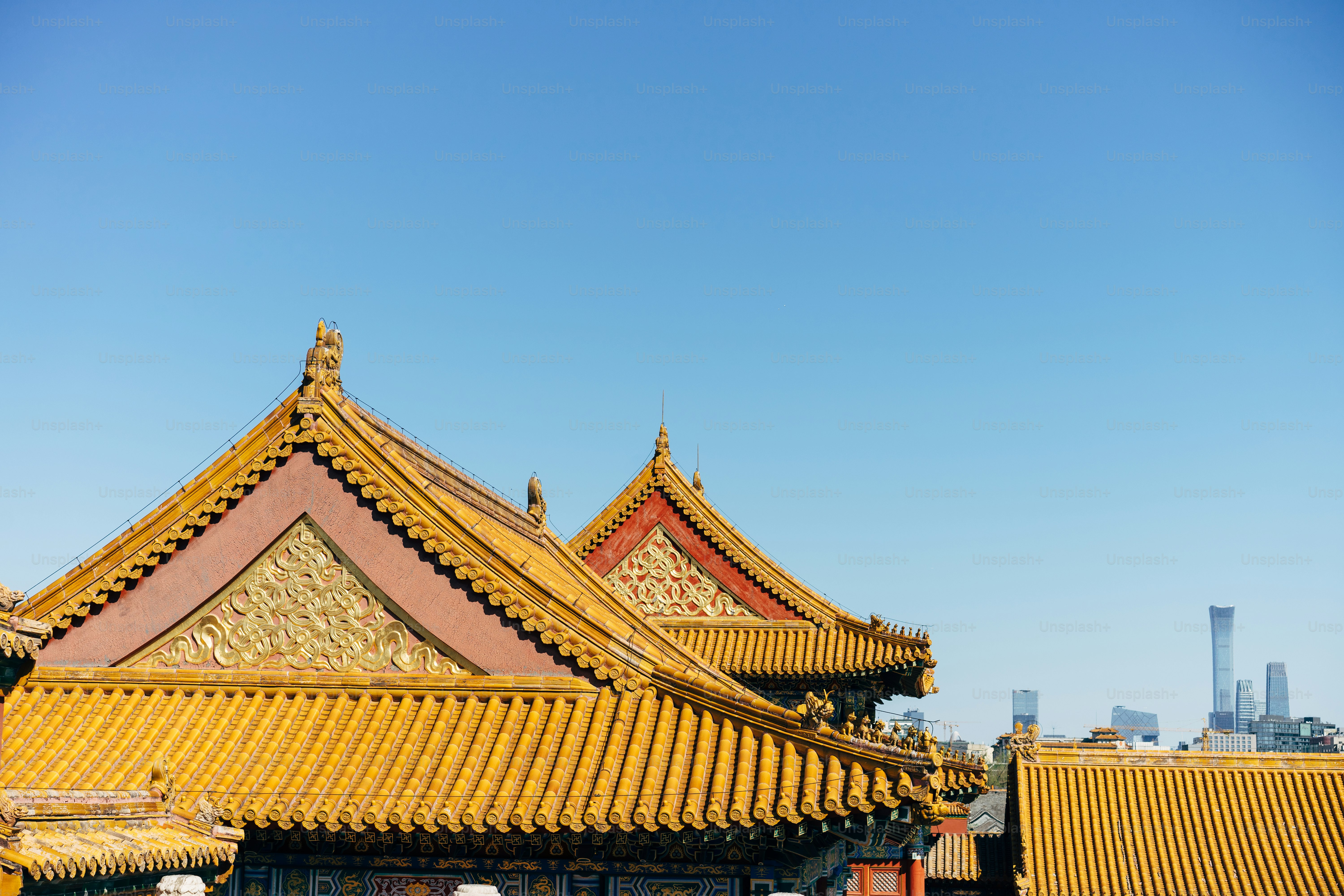 the roof of a building with a blue sky in the background