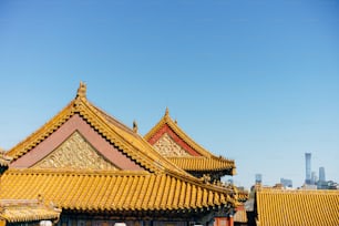 the roof of a building with a blue sky in the background