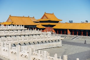 a large building with a yellow roof and yellow roof tiles