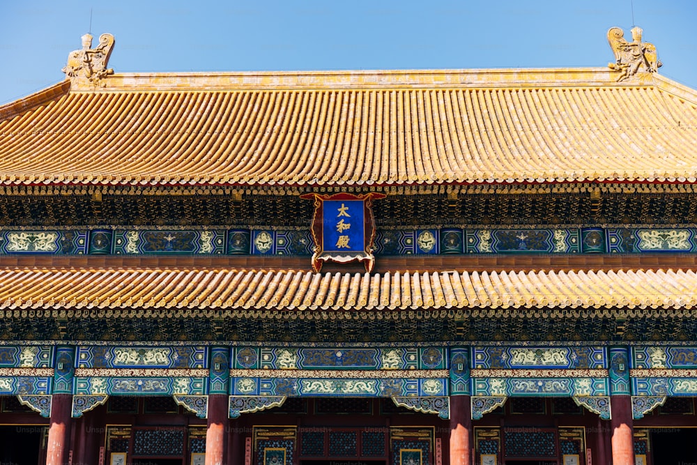 a building with a blue sign hanging from it's side