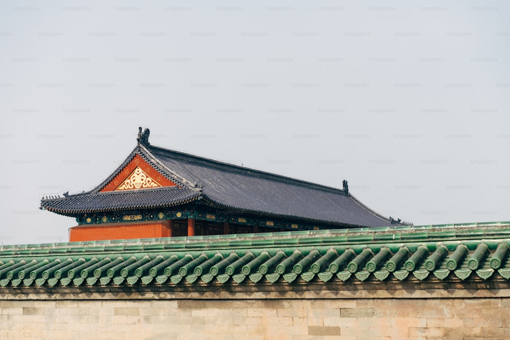 the roof of a building with a sky background