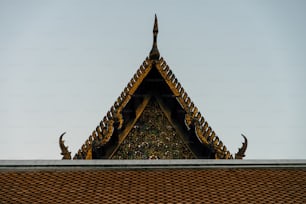 the roof of a building with a bird on top of it