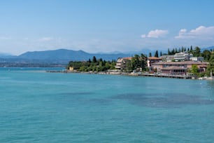 a body of water with houses on the shore