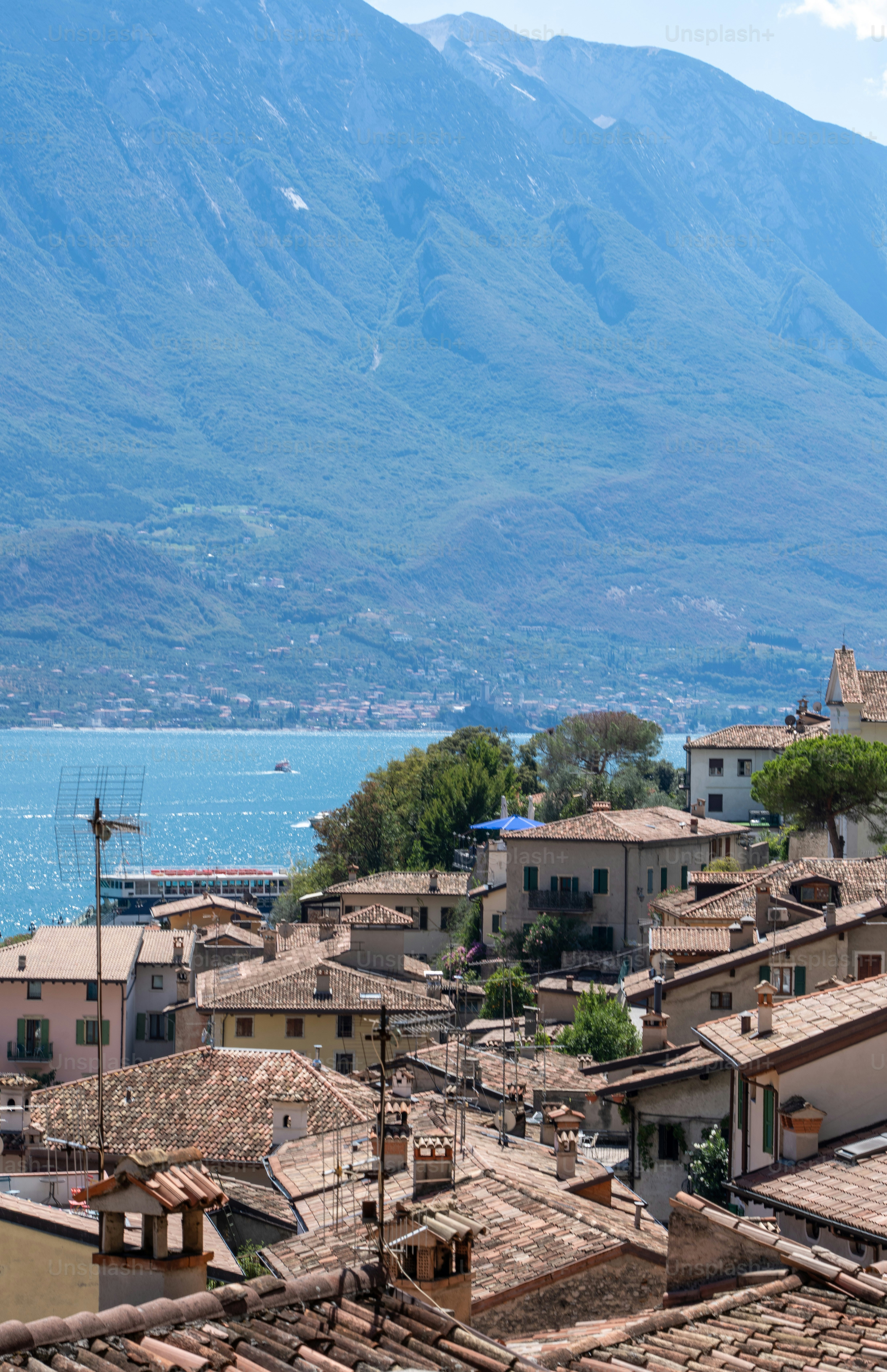 a view of a town with mountains in the background