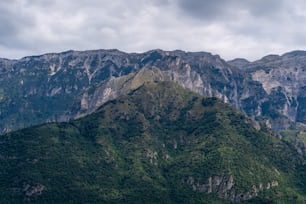 a mountain range with a boat in the foreground