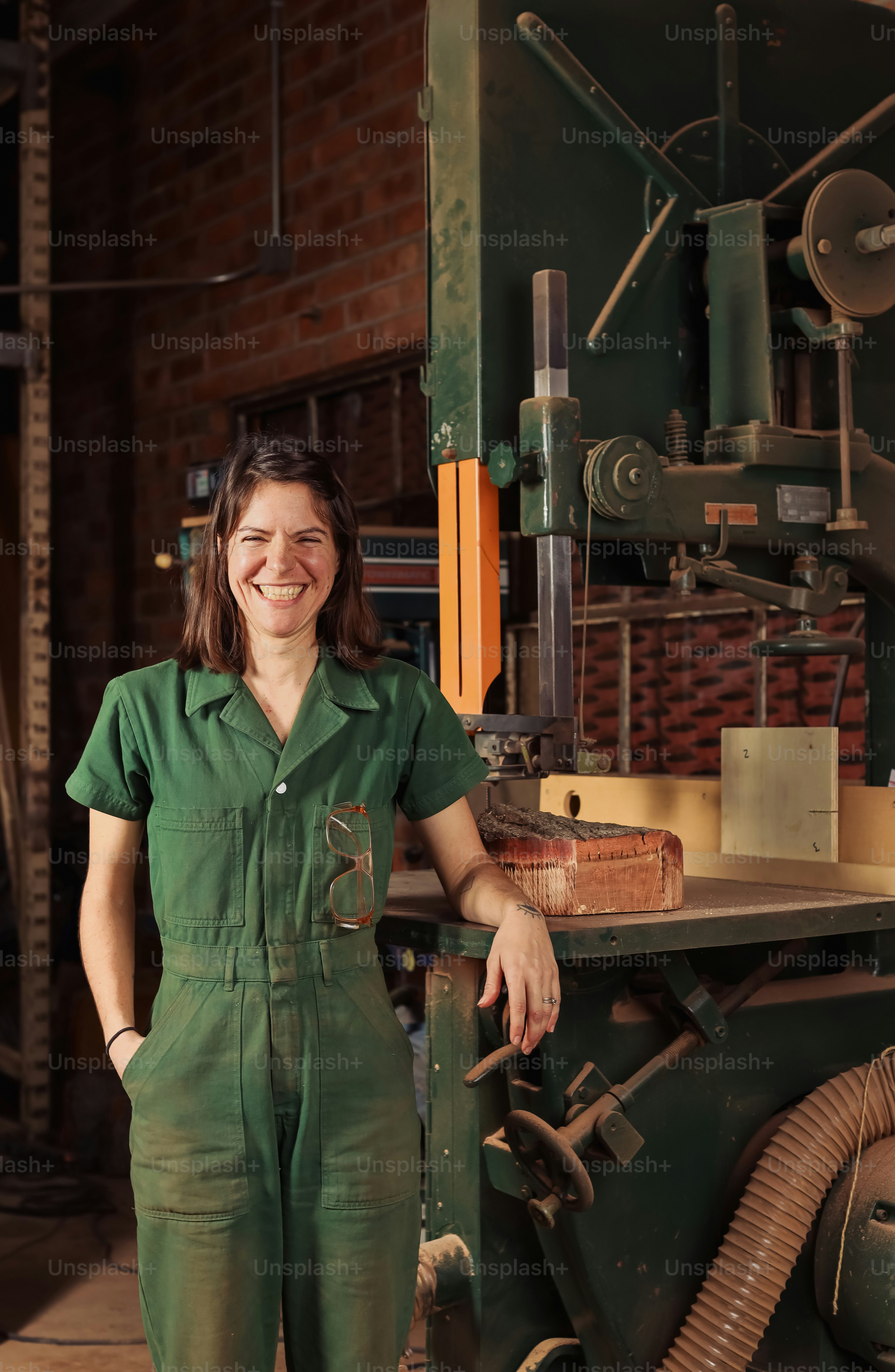 a woman standing in front of a machine