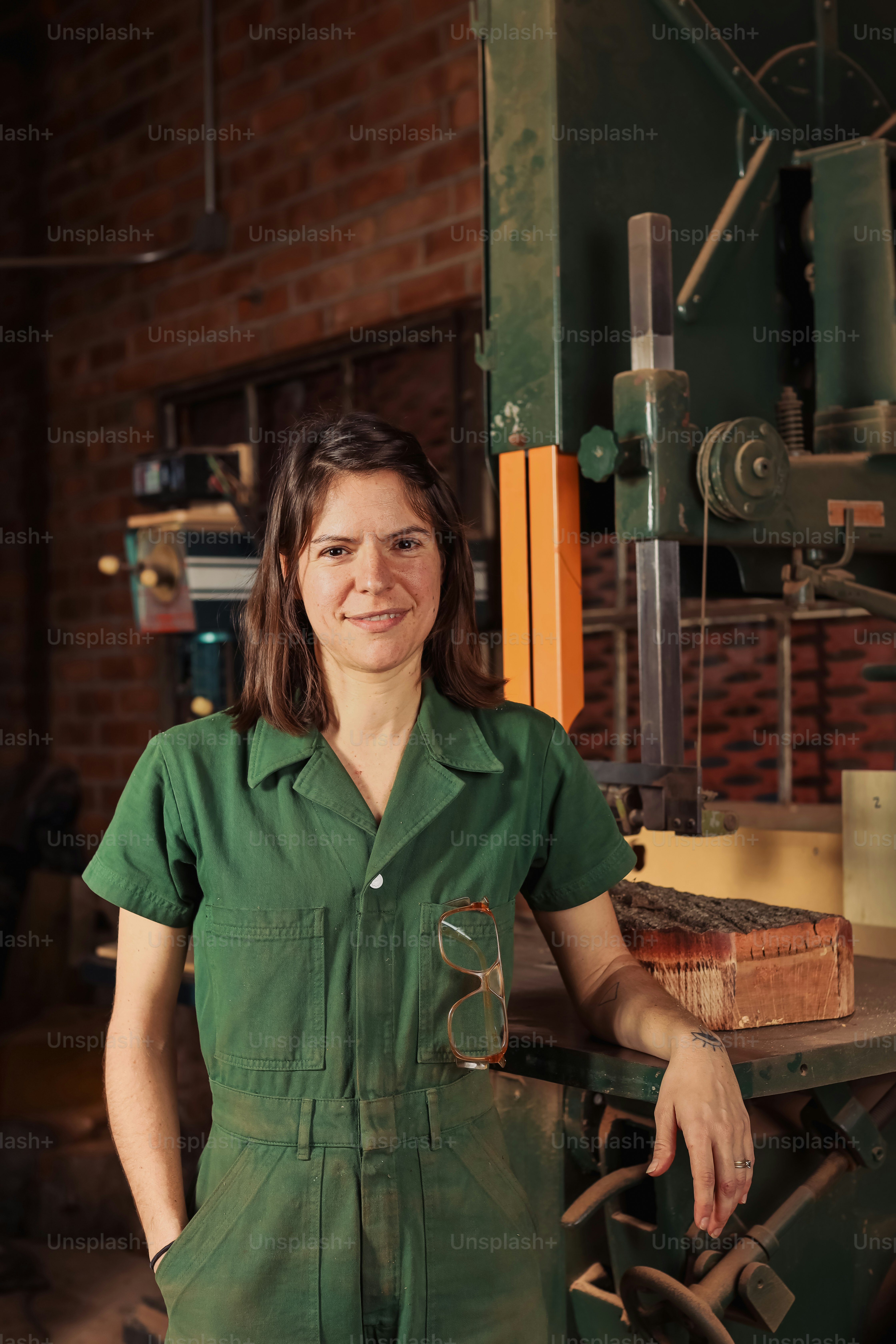 a woman standing in front of a machine