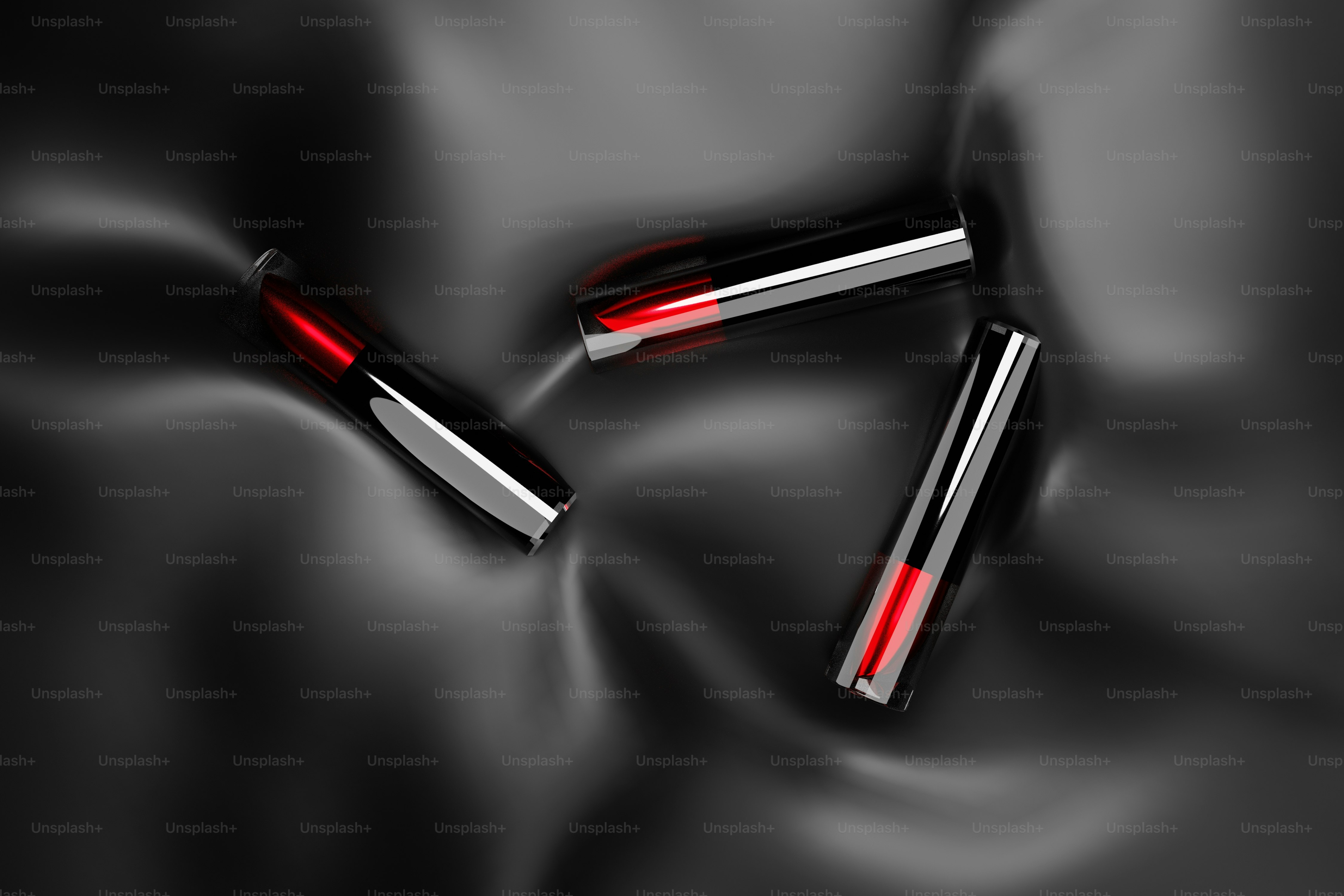 Ein paar Batterien sitzen auf einer schwarzen Oberfläche