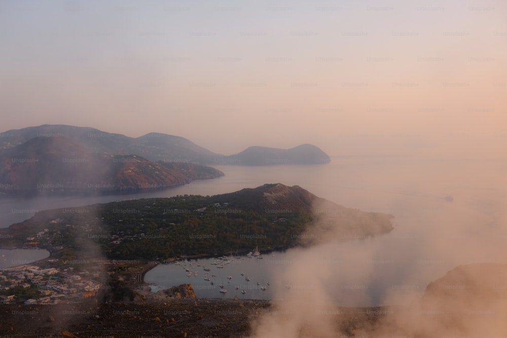 an aerial view of a body of water surrounded by mountains