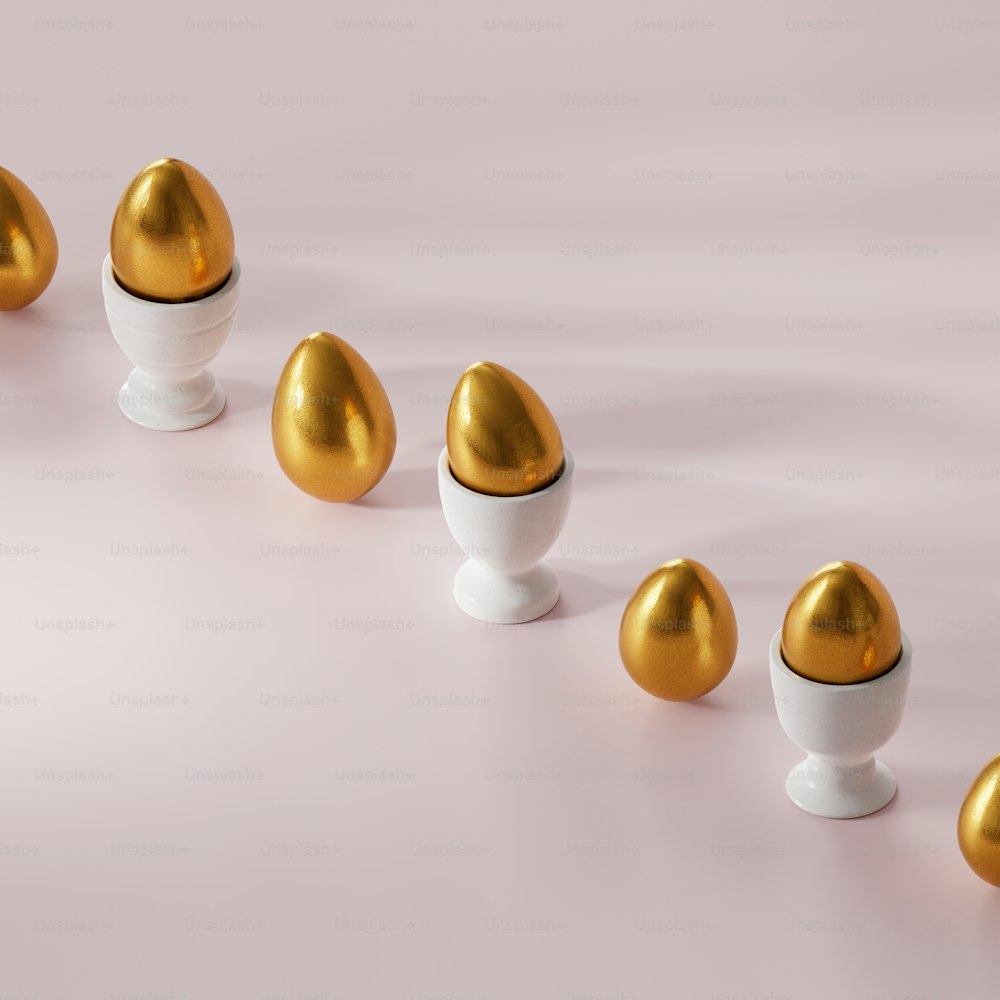 a row of golden eggs in a white egg cup