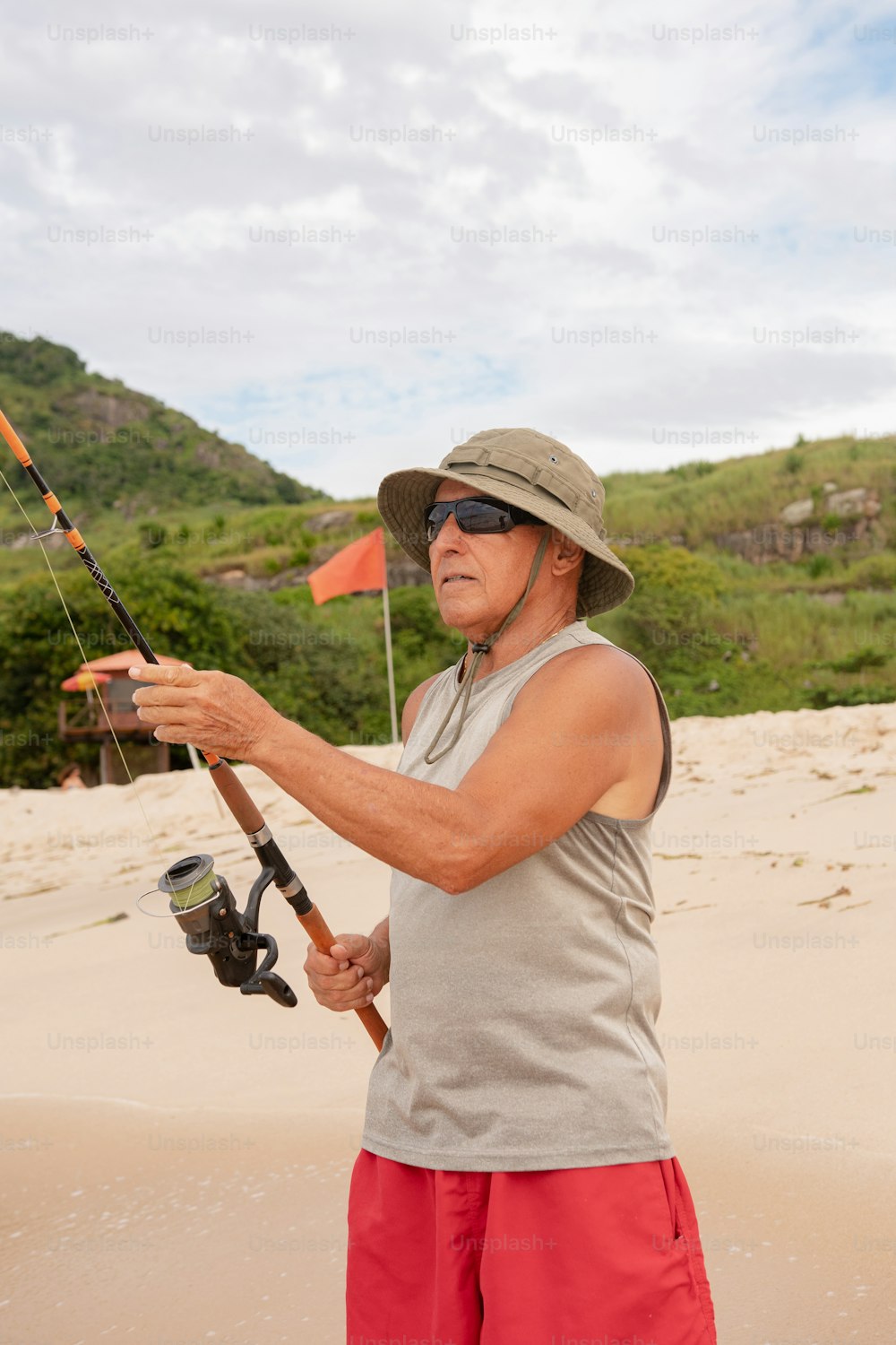 a man holding a fishing rod and a fishing pole