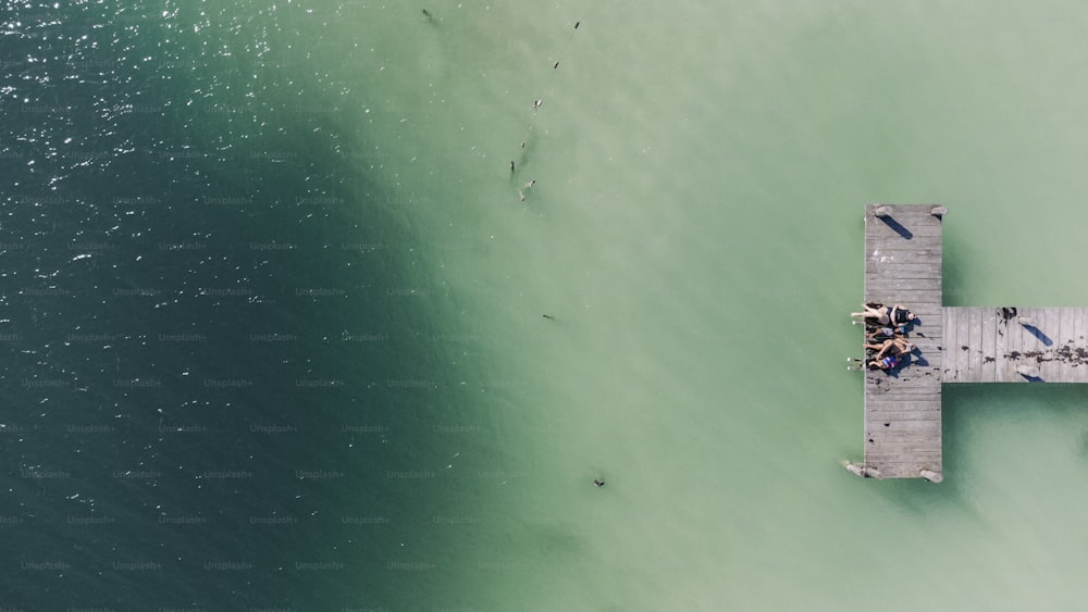 a pier in the middle of a body of water