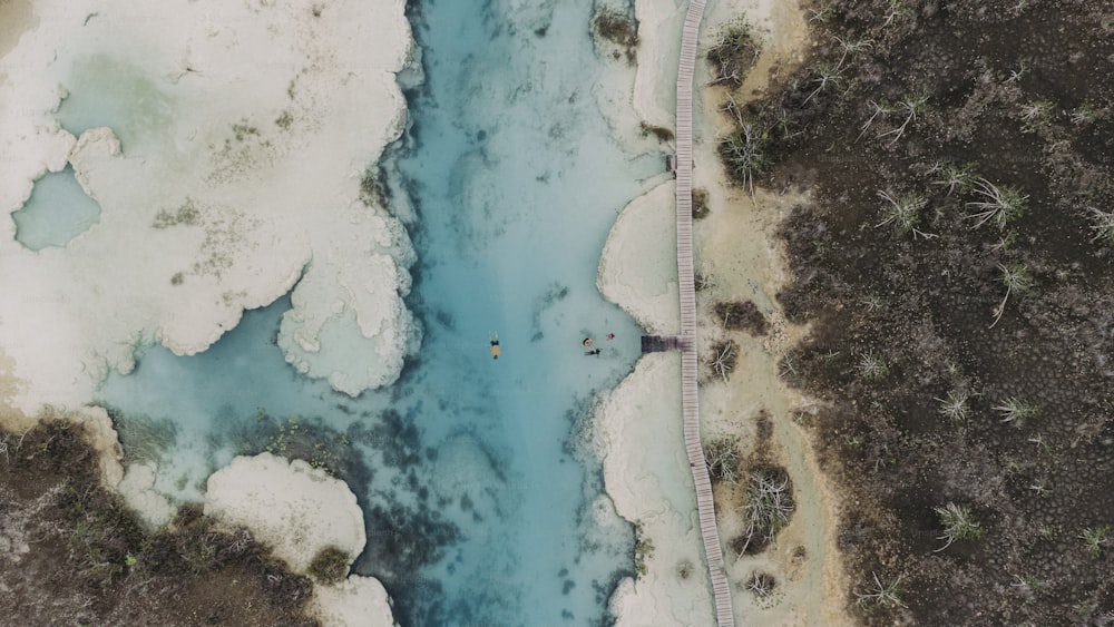 an aerial view of a body of water surrounded by land