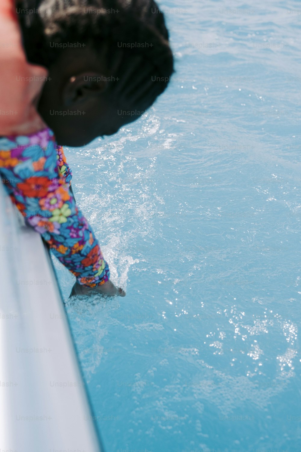 a person standing on a boat in the water