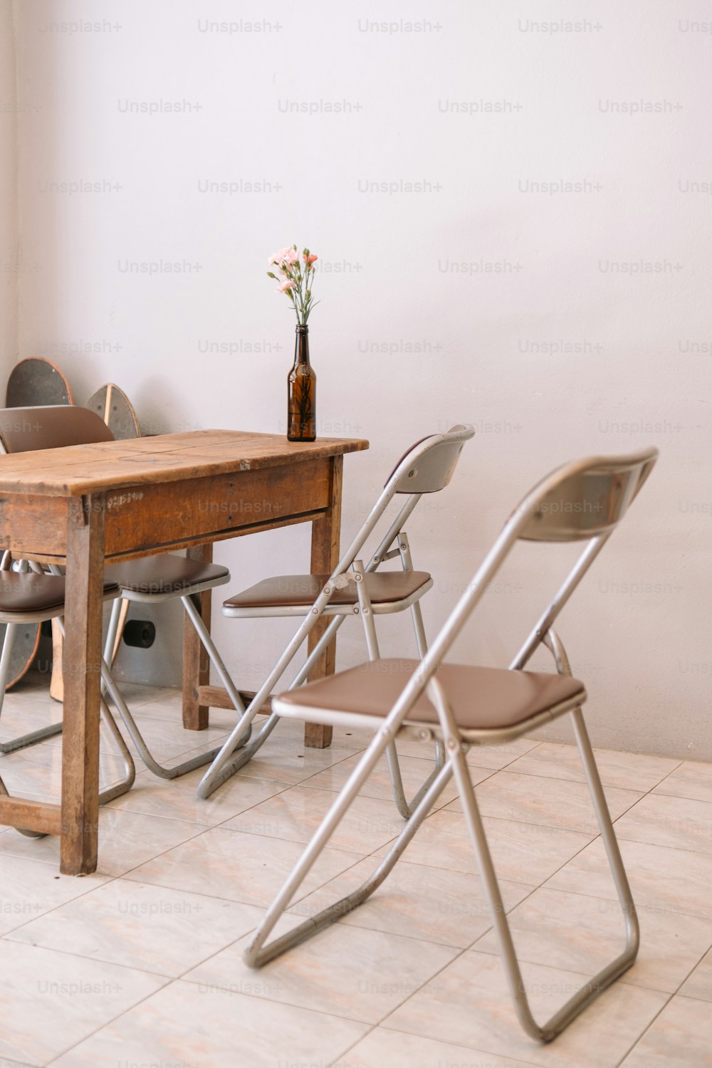 a wooden table with four chairs around it