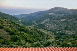 a view of a valley with mountains in the background