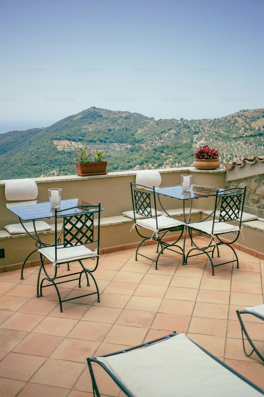 a couple of chairs sitting on top of a roof