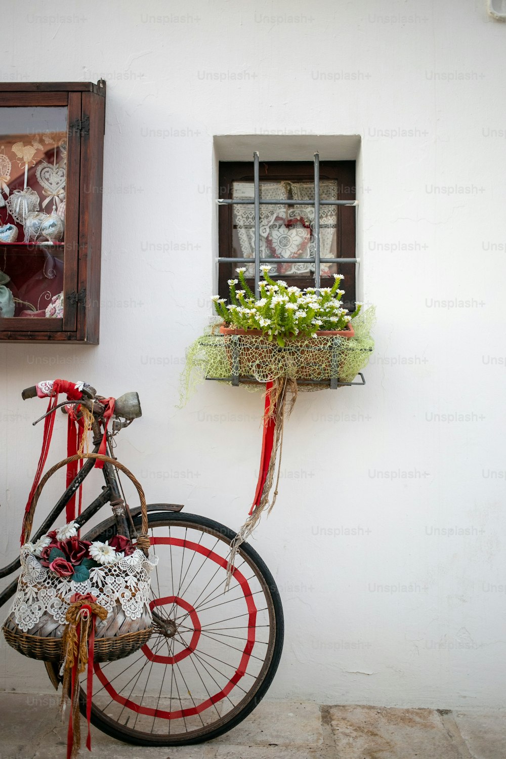 a bicycle is parked next to a window