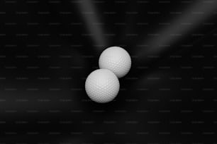 three white golf balls on a black background