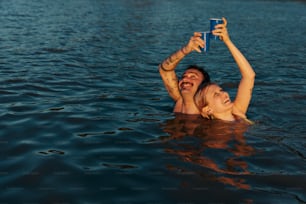 a man and a woman are floating in the water