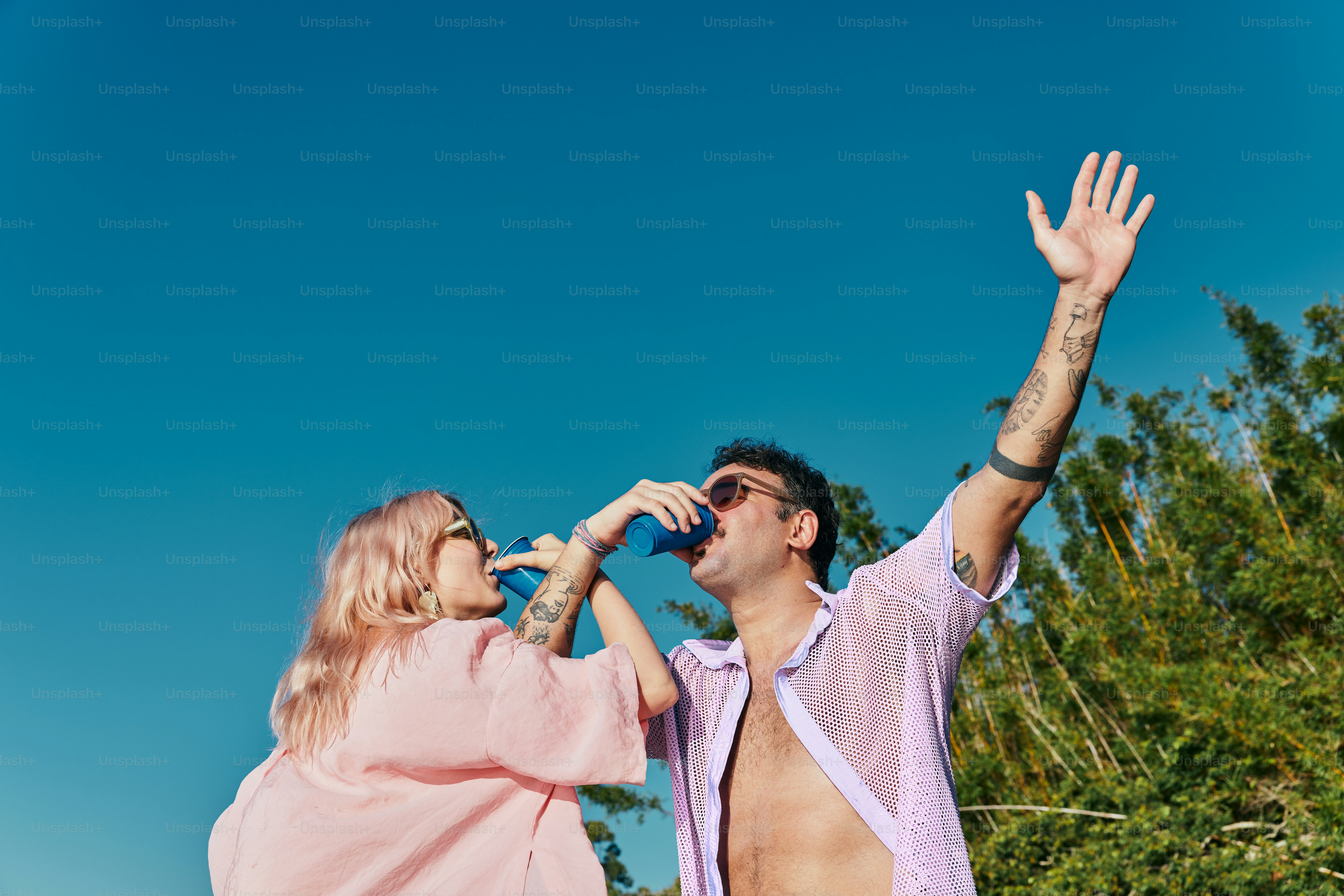 a man and a woman are drinking water