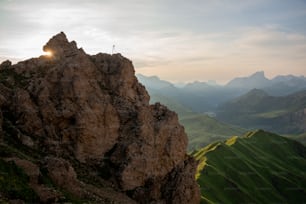 a person standing on the top of a mountain