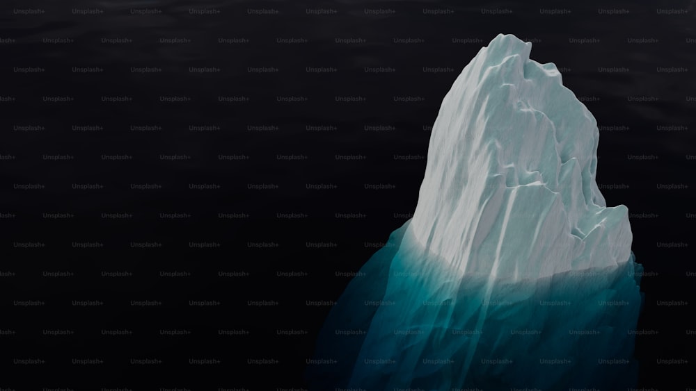 a large iceberg floating in the water