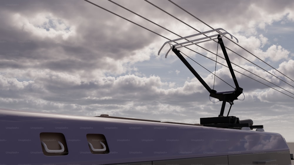 a train car sitting under a cloudy sky