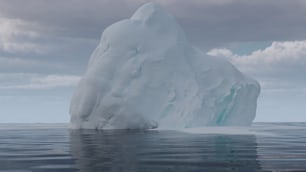 a large iceberg floating on top of a body of water