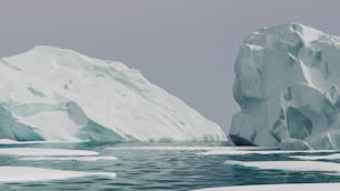 a large iceberg floating in the middle of a body of water