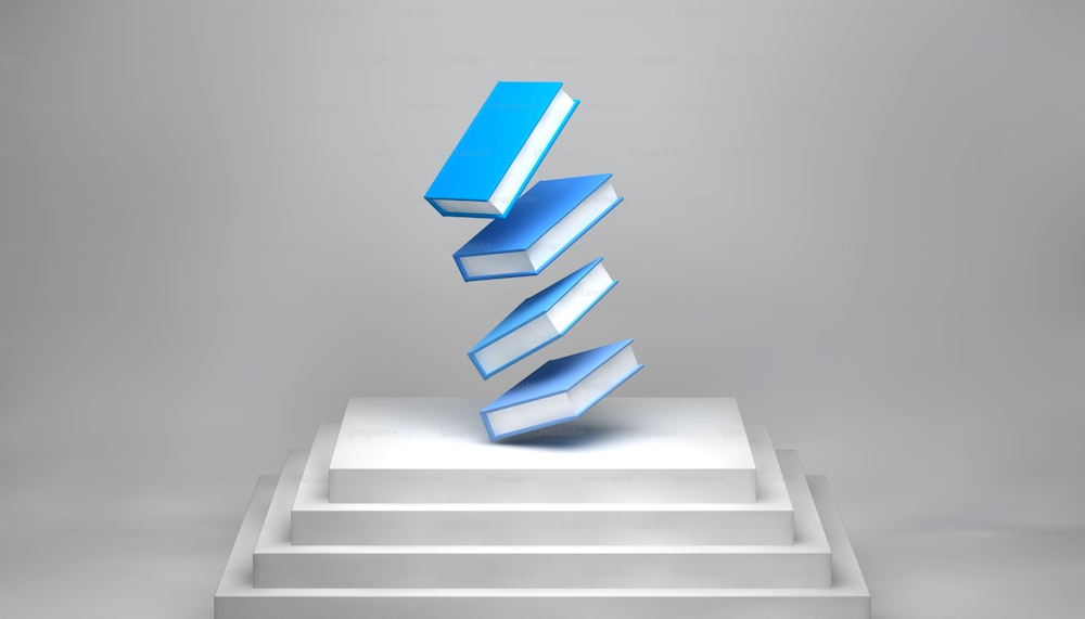 a stack of blue books sitting on top of a white pedestal
