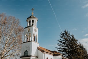 a white church with a cross on top of it
