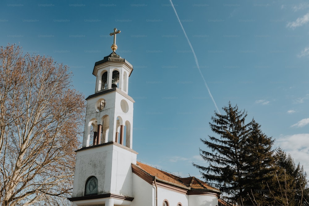 a white church with a cross on top of it