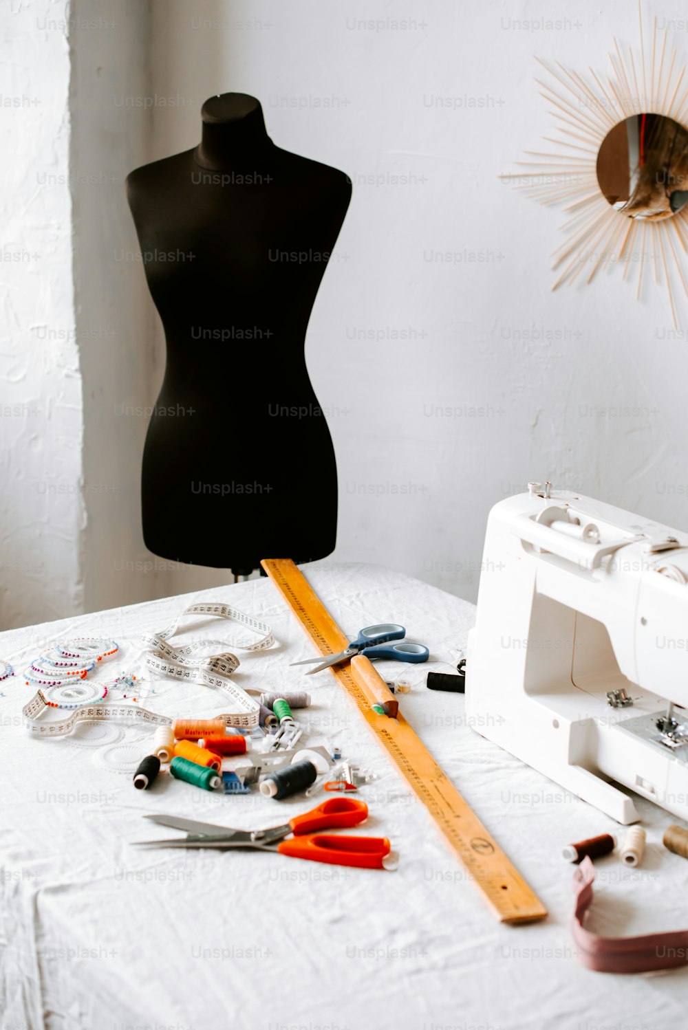 a sewing machine sitting on top of a white table