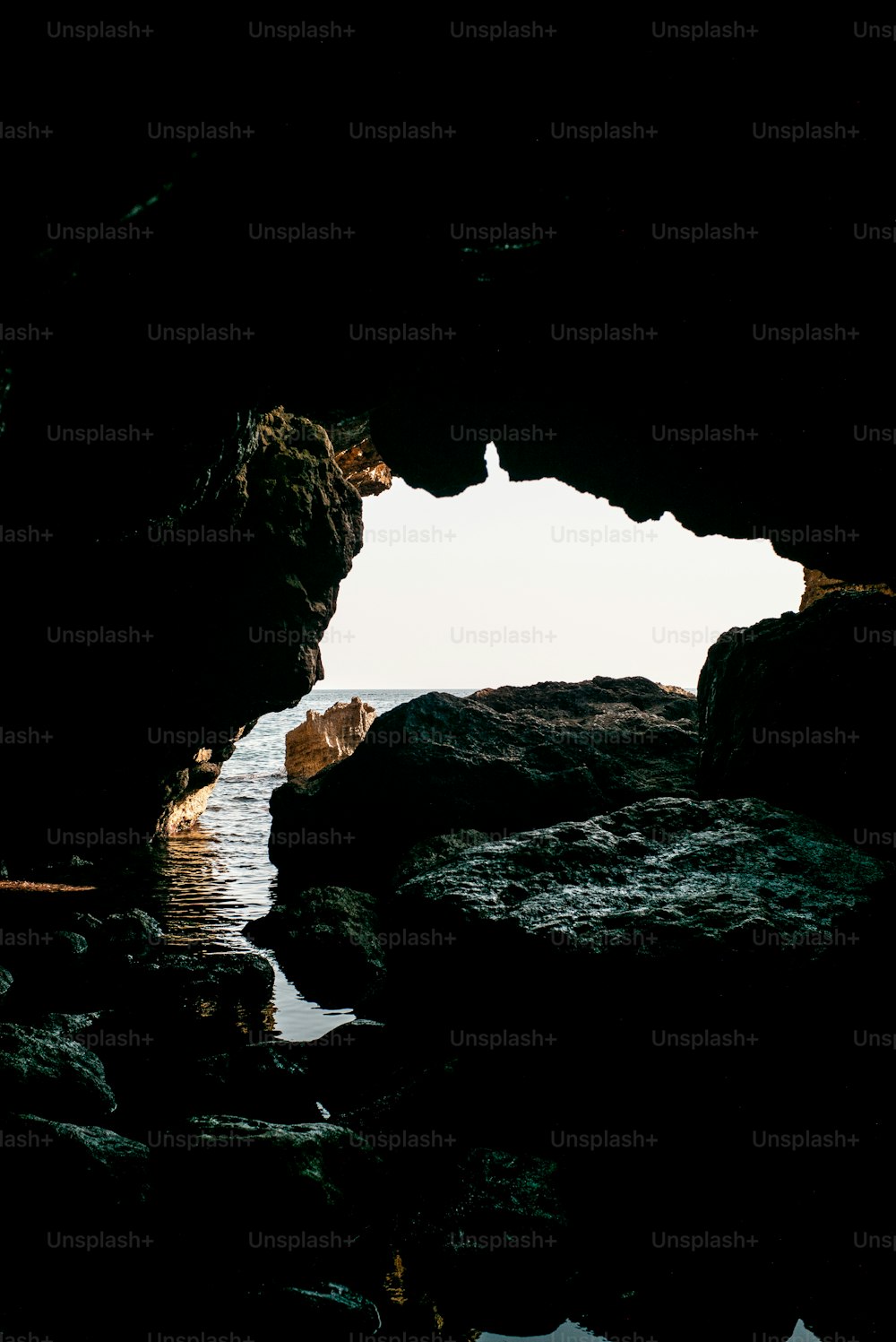 a view of the ocean from inside a cave