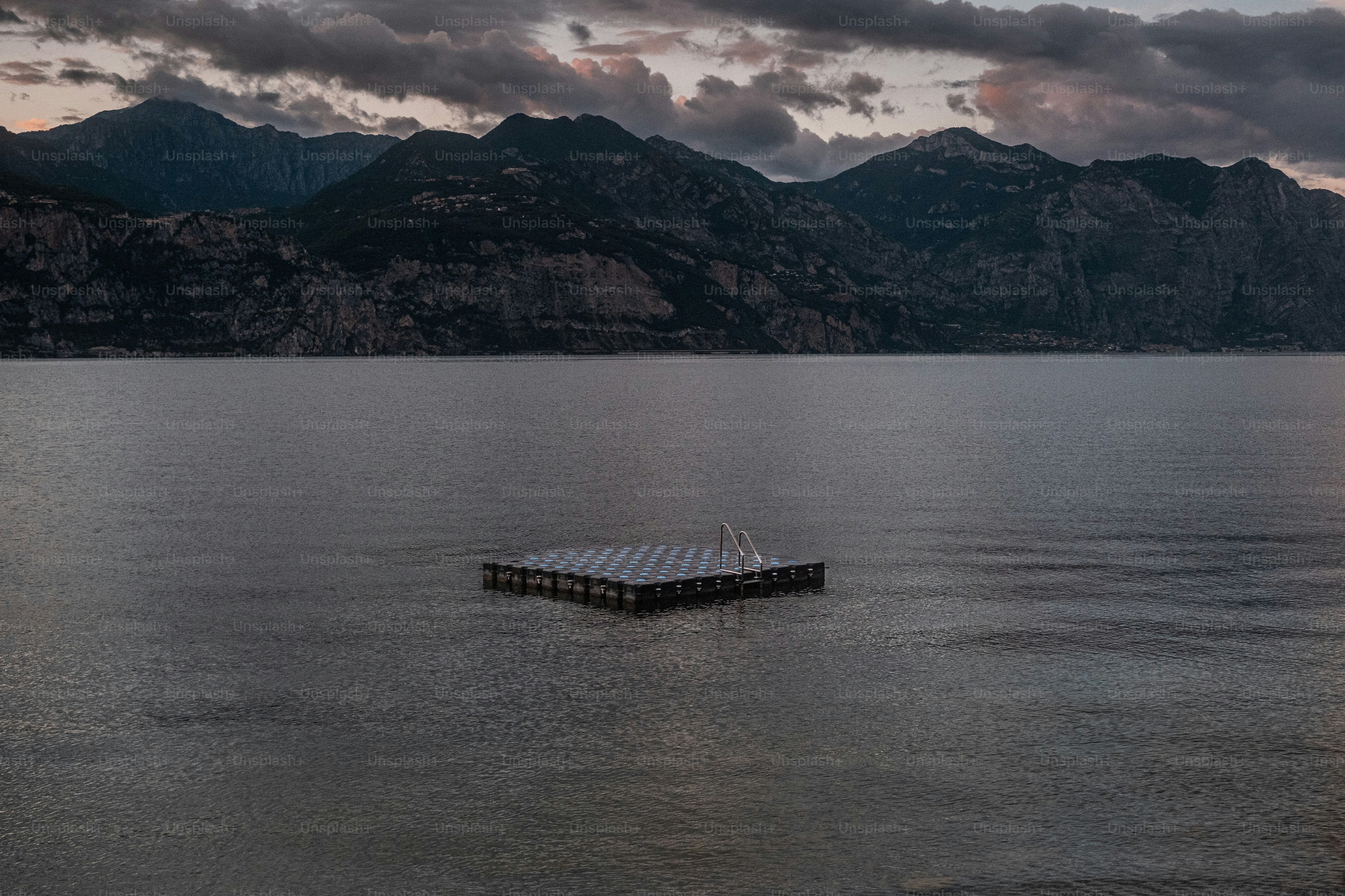 a boat floating on top of a large body of water